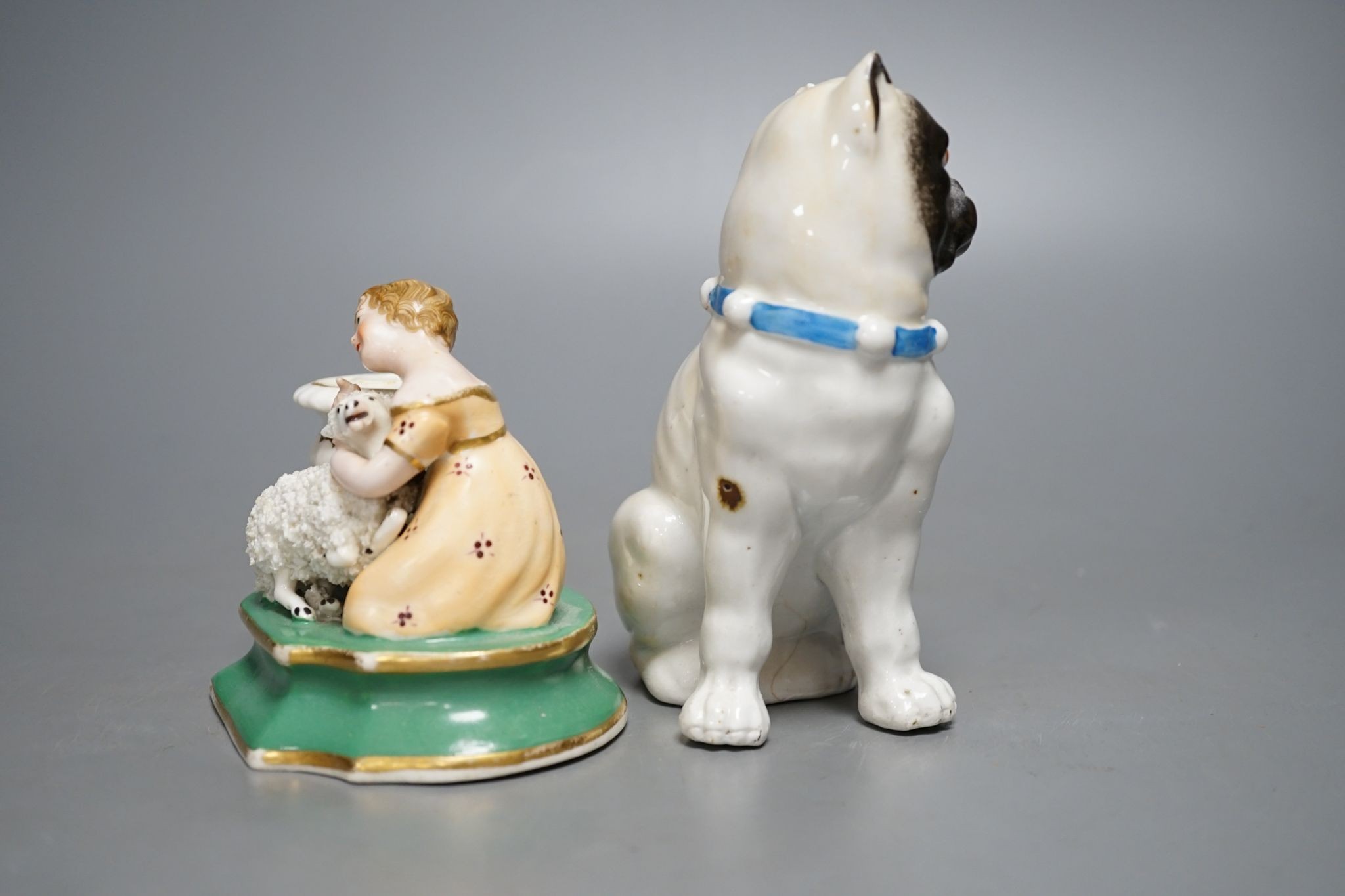 An English porcelain girl with sheep inkwell, c.1835 and a Continental porcelain pug dog, 14cm